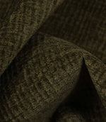 Detailed macro view of Everleigh Moss upholstery fire retardant fabric revealing the plush velour texture and subtle moss green woven pattern.