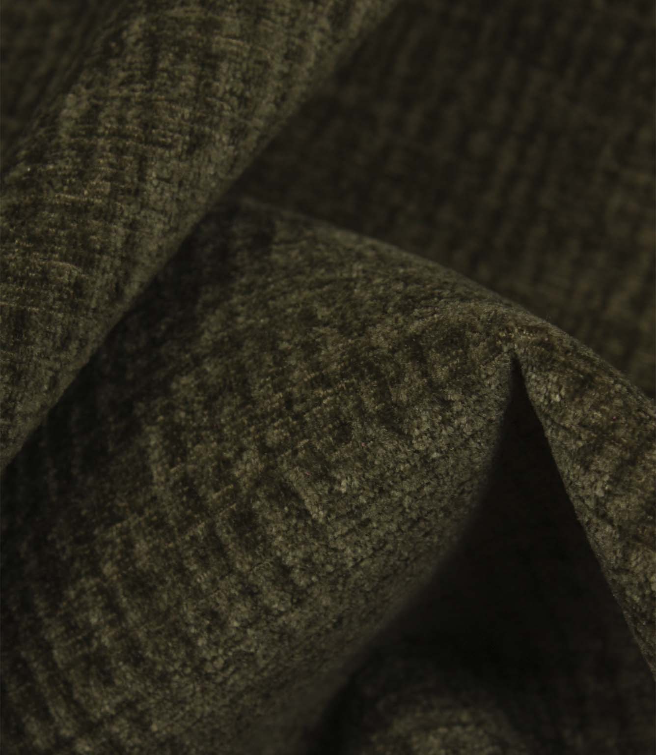 Detailed macro view of Everleigh Moss upholstery fire retardant fabric revealing the plush velour texture and subtle moss green woven pattern.
