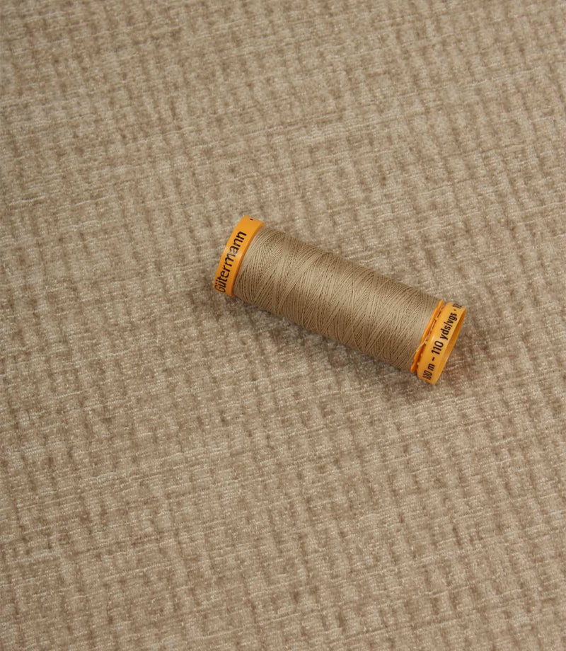 Everleigh Pebble upholstery fire retardant fabric with coordinating thread, highlighting the soft-touch texture and woven plain design.