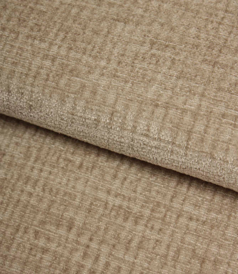 Folded Everleigh Pebble plain upholstery fabric displaying its luxurious velour-inspired finish and textured neutral appearance.