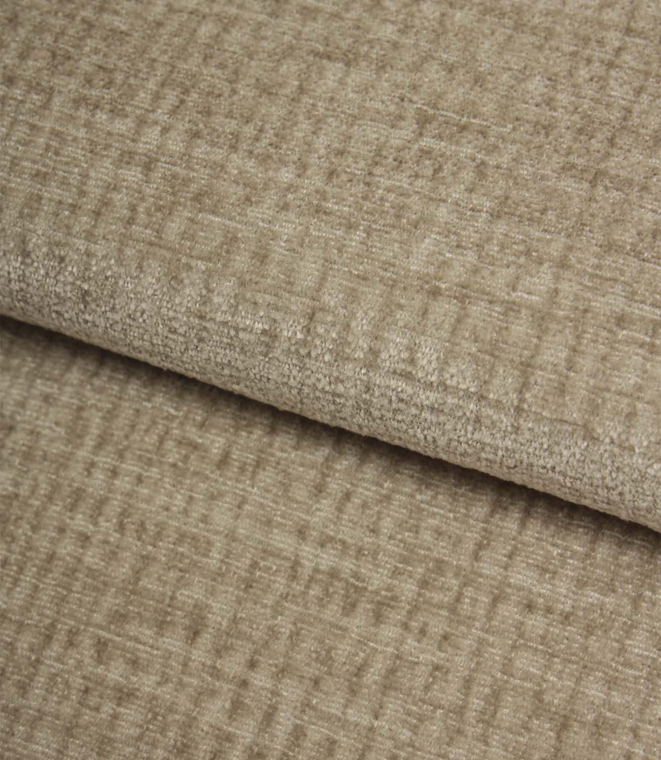 Folded Everleigh Pebble plain upholstery fabric displaying its luxurious velour-inspired finish and textured neutral appearance.
