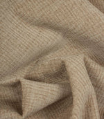 Draped Everleigh Pebble upholstery fabric showing the soft handle, elegant movement and richly textured woven surface.