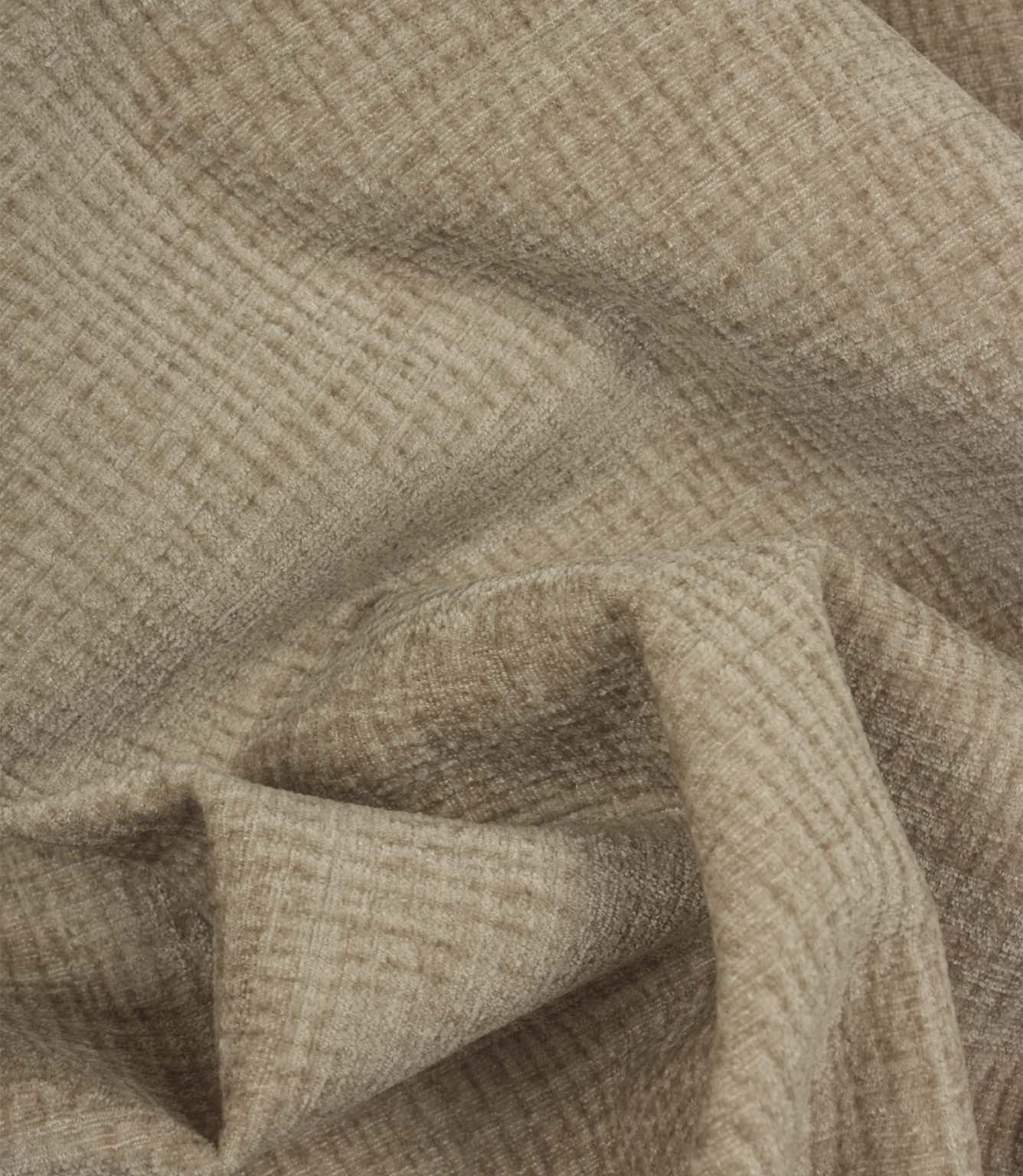 Draped Everleigh Pebble upholstery fabric showing the soft handle, elegant movement and richly textured woven surface.