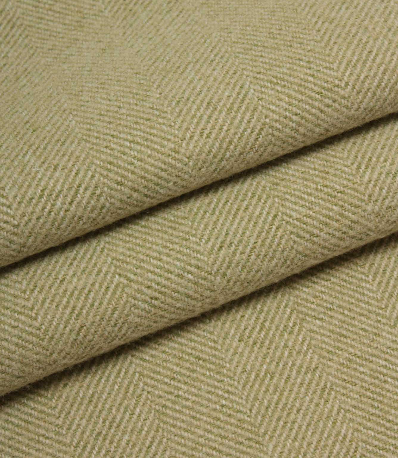 Close-up of green herringbone fabric