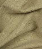 Close-up of green fabric with a herringbone pattern