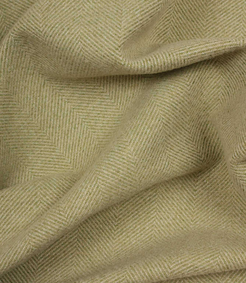 Close-up of green fabric with a herringbone pattern