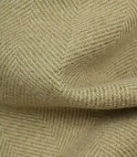 Close-up of green fabric with a herringbone pattern