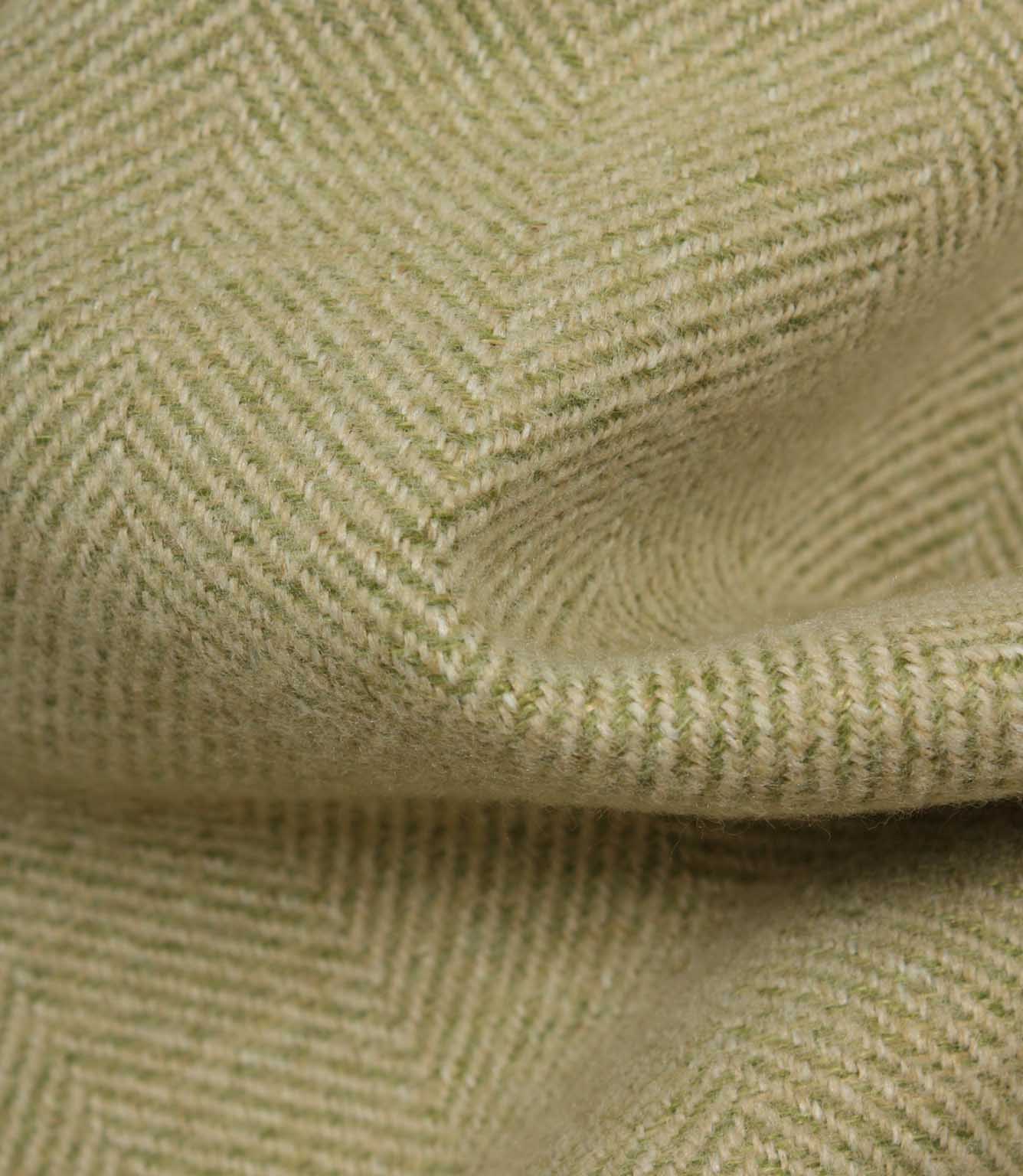 Close-up of green fabric with a herringbone pattern