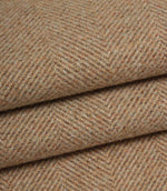 Close-up of blush and brown herringbone fabric with a subtle pattern