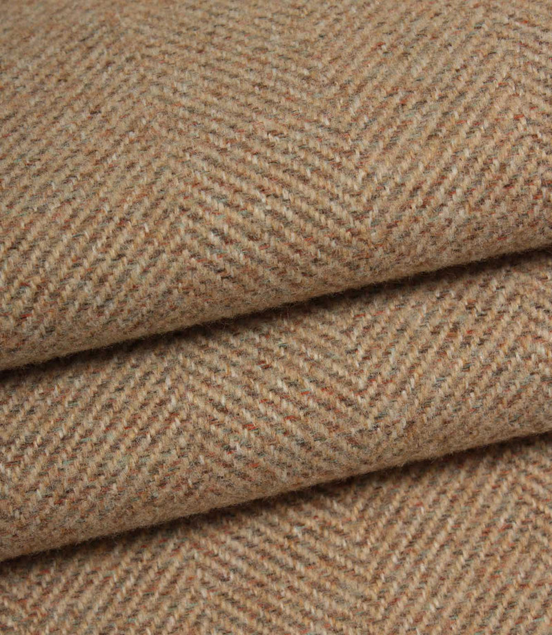 Close-up of blush and brown herringbone fabric with a subtle pattern