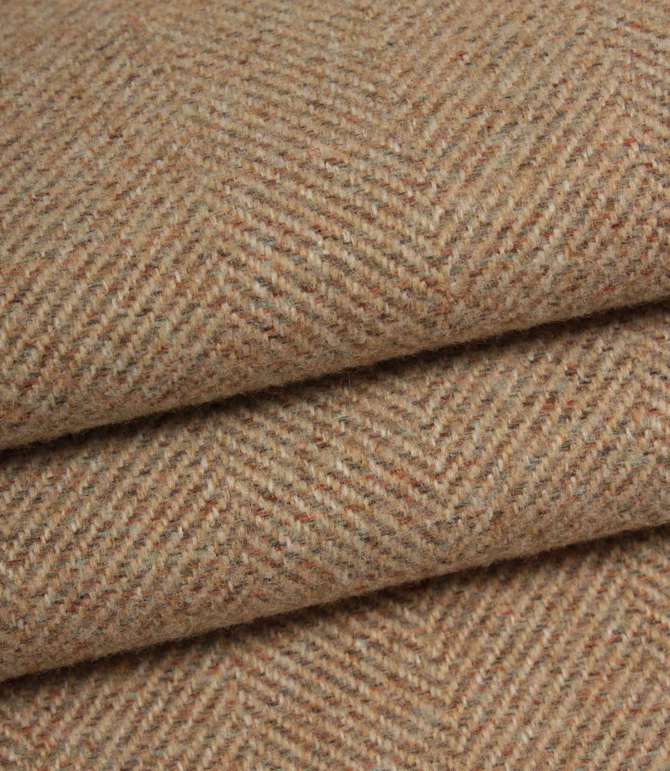 Close-up of blush and brown herringbone fabric with a subtle pattern