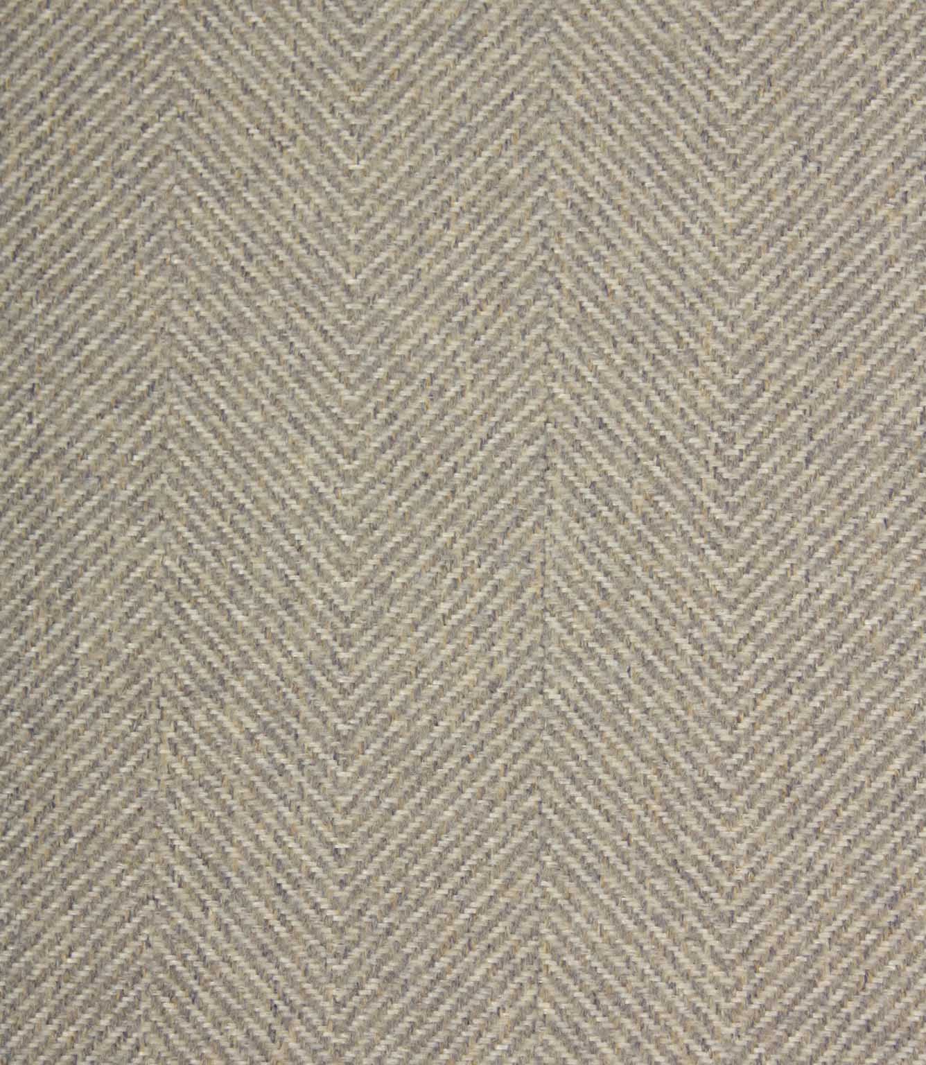 Textured fabric with a herringbone pattern in grey tones.