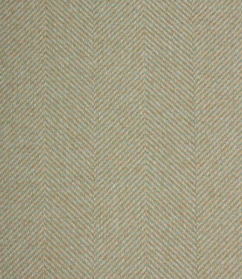 Textured fabric with a herringbone pattern in light green tones.
