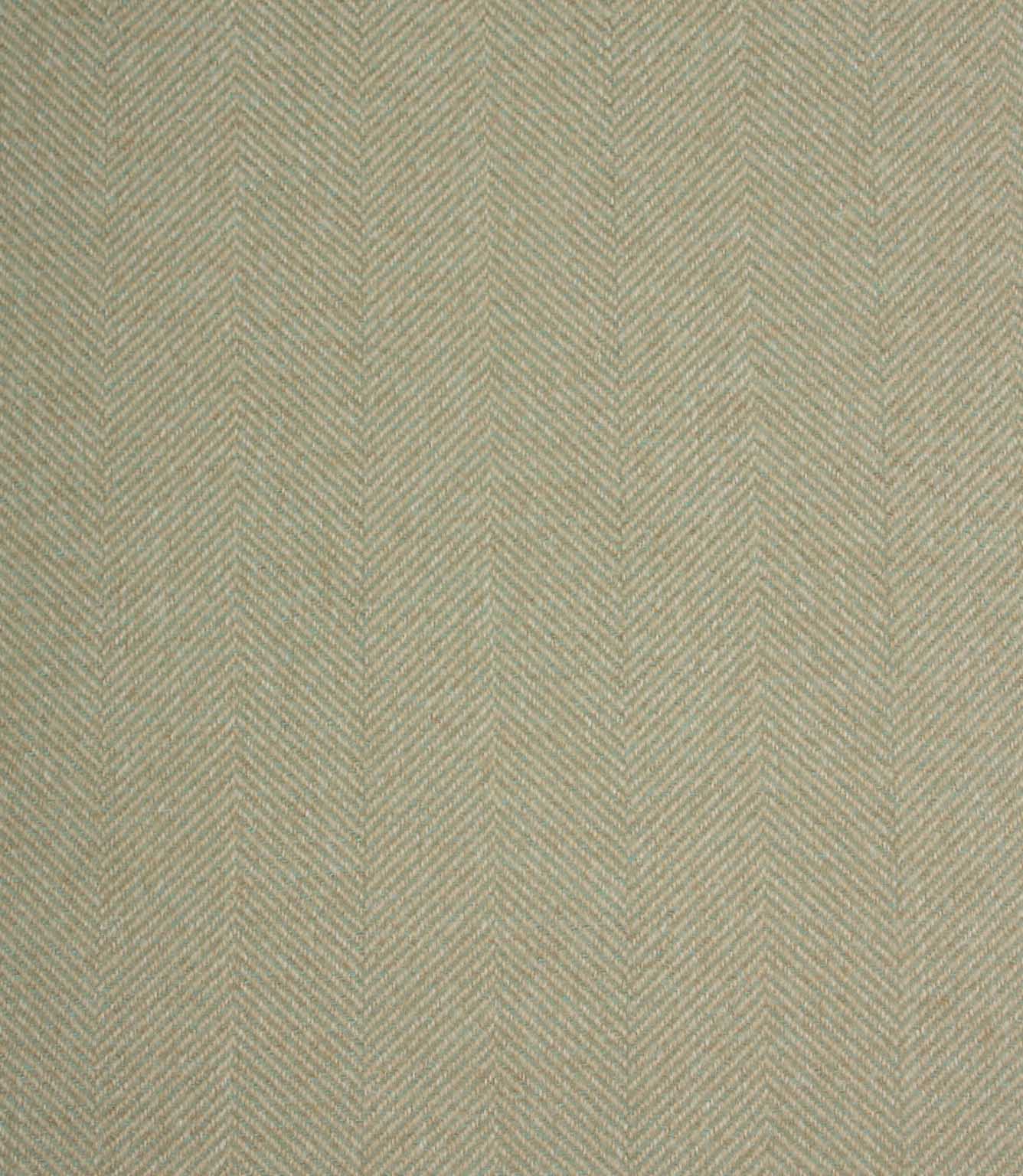 Textured fabric with a herringbone pattern in light green tones