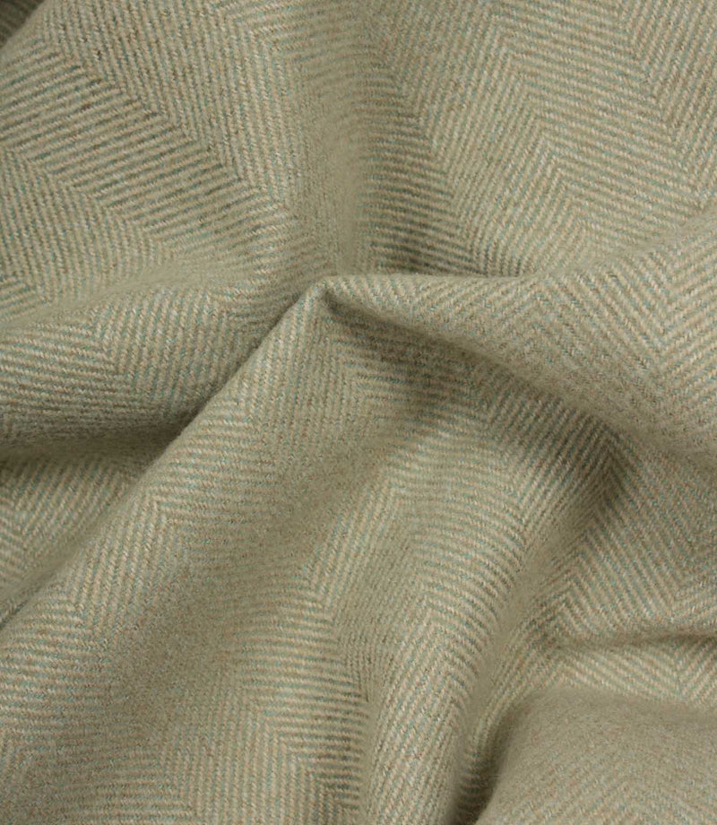 Close-up of green herringbone fabric texture