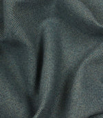 Close-up of textured blue fabric with a herringbone pattern