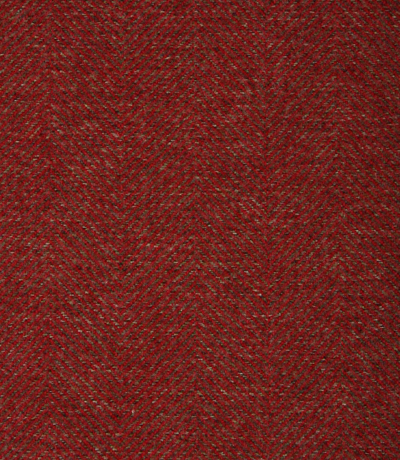Close-up of a textured red herringbone fabric with a subtle pattern