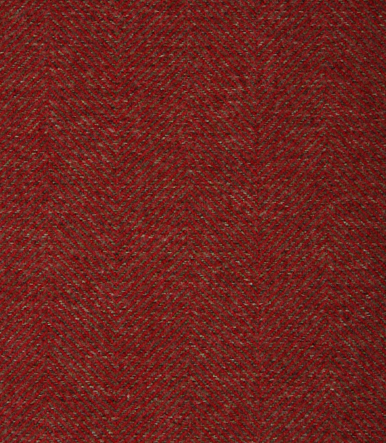 Close-up of a textured red herringbone fabric with a subtle pattern