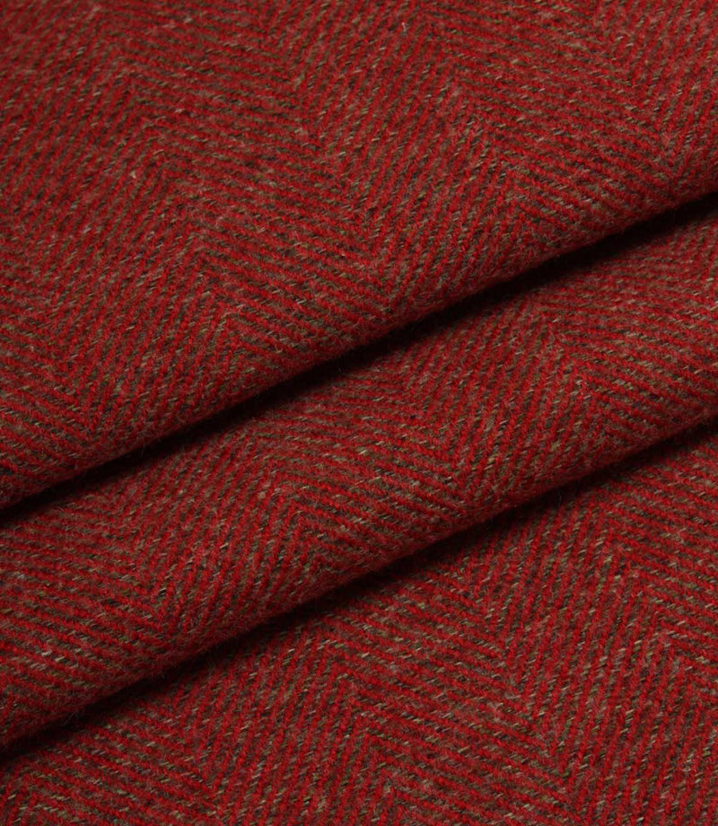 Close-up of red fabric with a subtle herringbone pattern