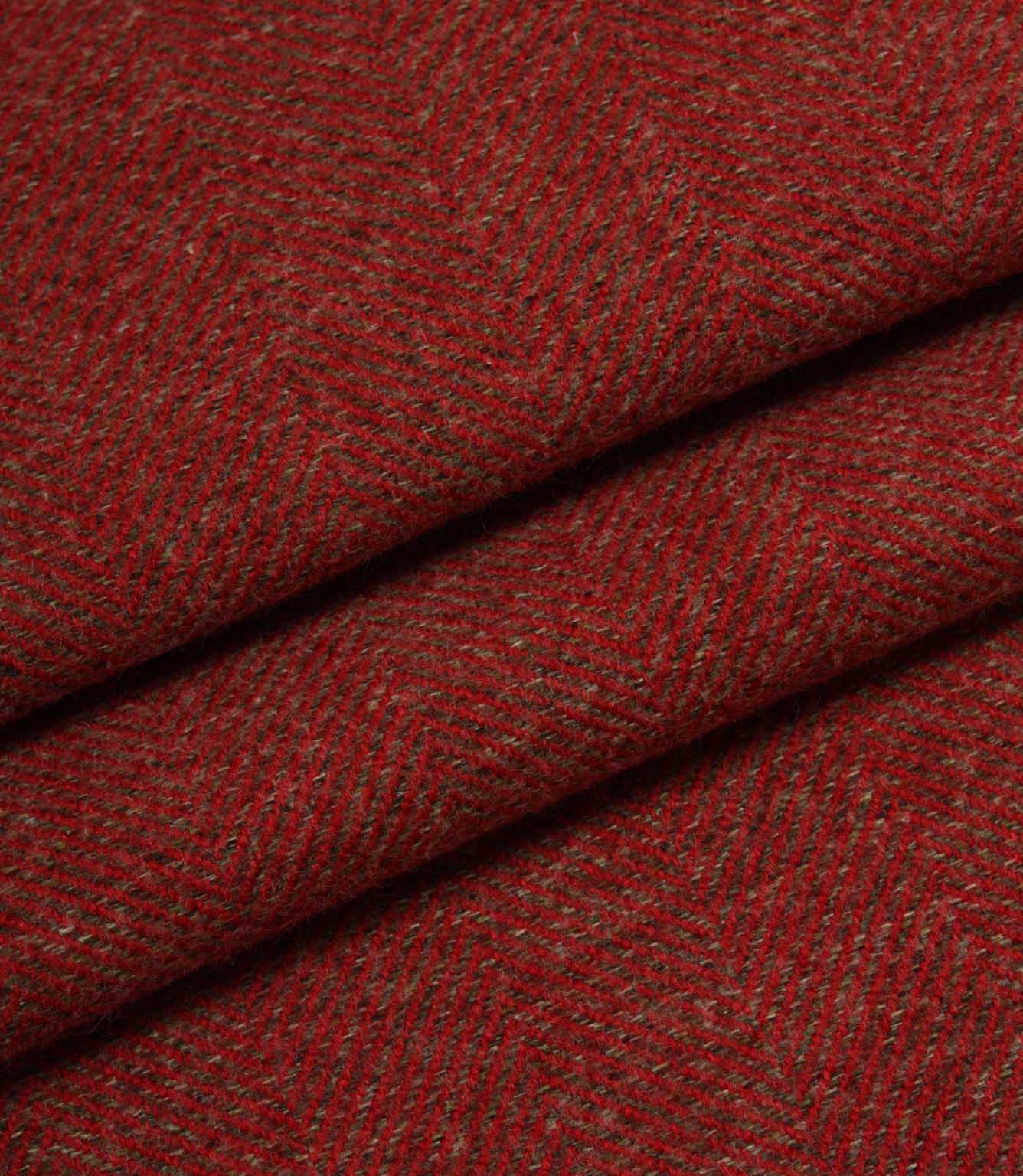Close-up of red fabric with a subtle herringbone pattern