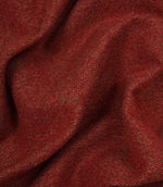 Close-up of red fabric with a textured herringbone pattern