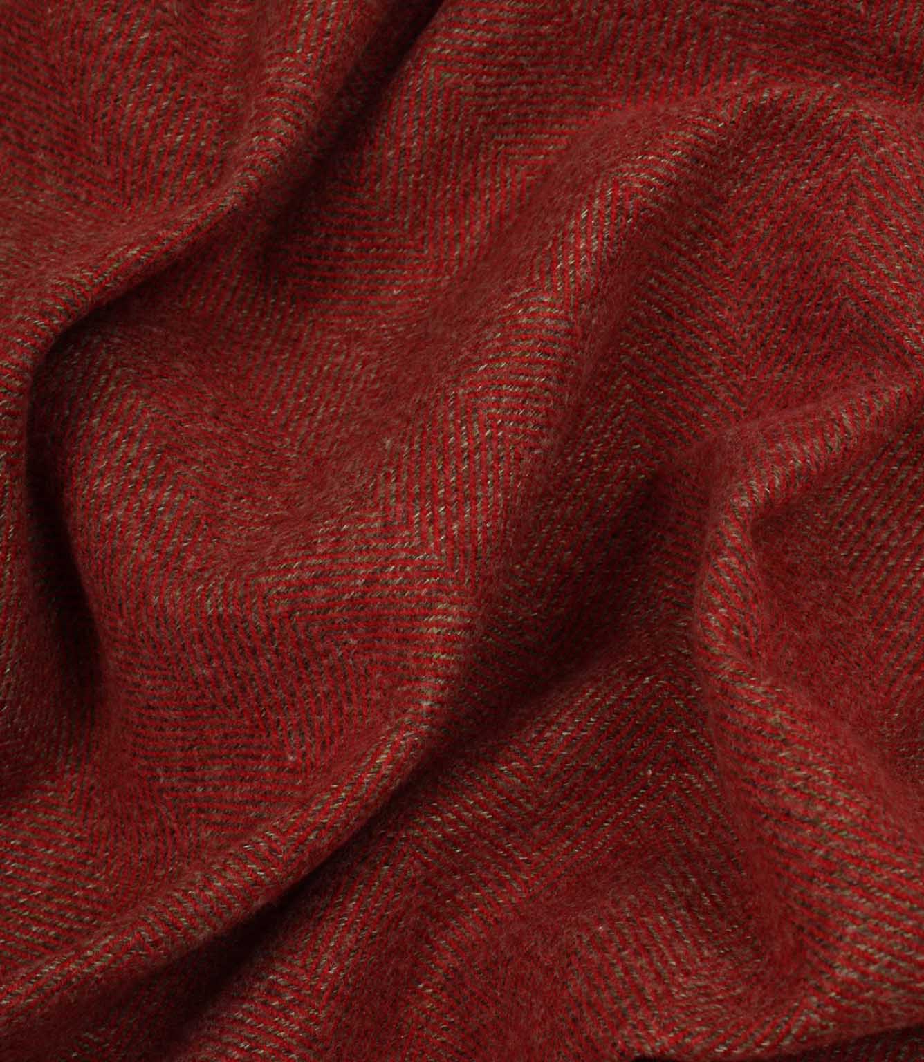 Close-up of red fabric with a textured herringbone pattern