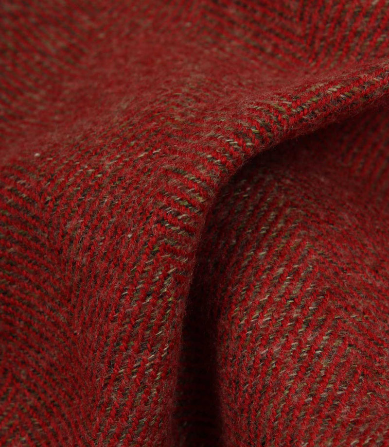 Close-up of red fabric with a herringbone pattern