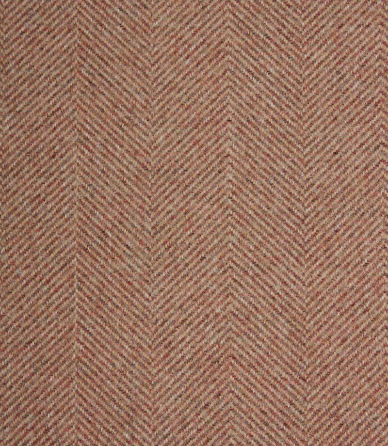 Textured fabric with a herringbone pattern in rose and beige tones.