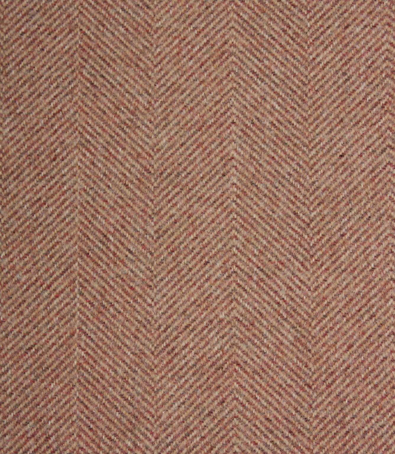 Textured fabric with a herringbone pattern in rose and beige tones.