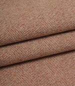 Close-up of rose herringbone fabric with a subtle pattern.