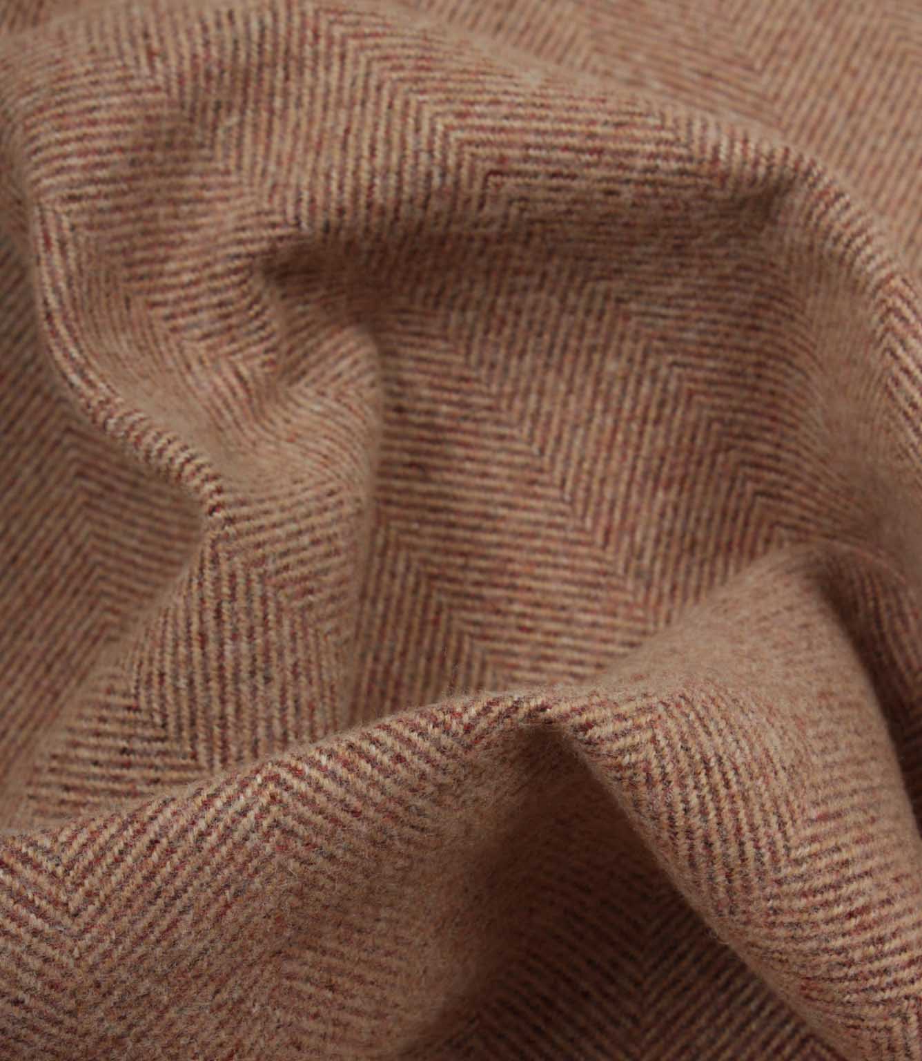 Close-up of rose herringbone fabric texture