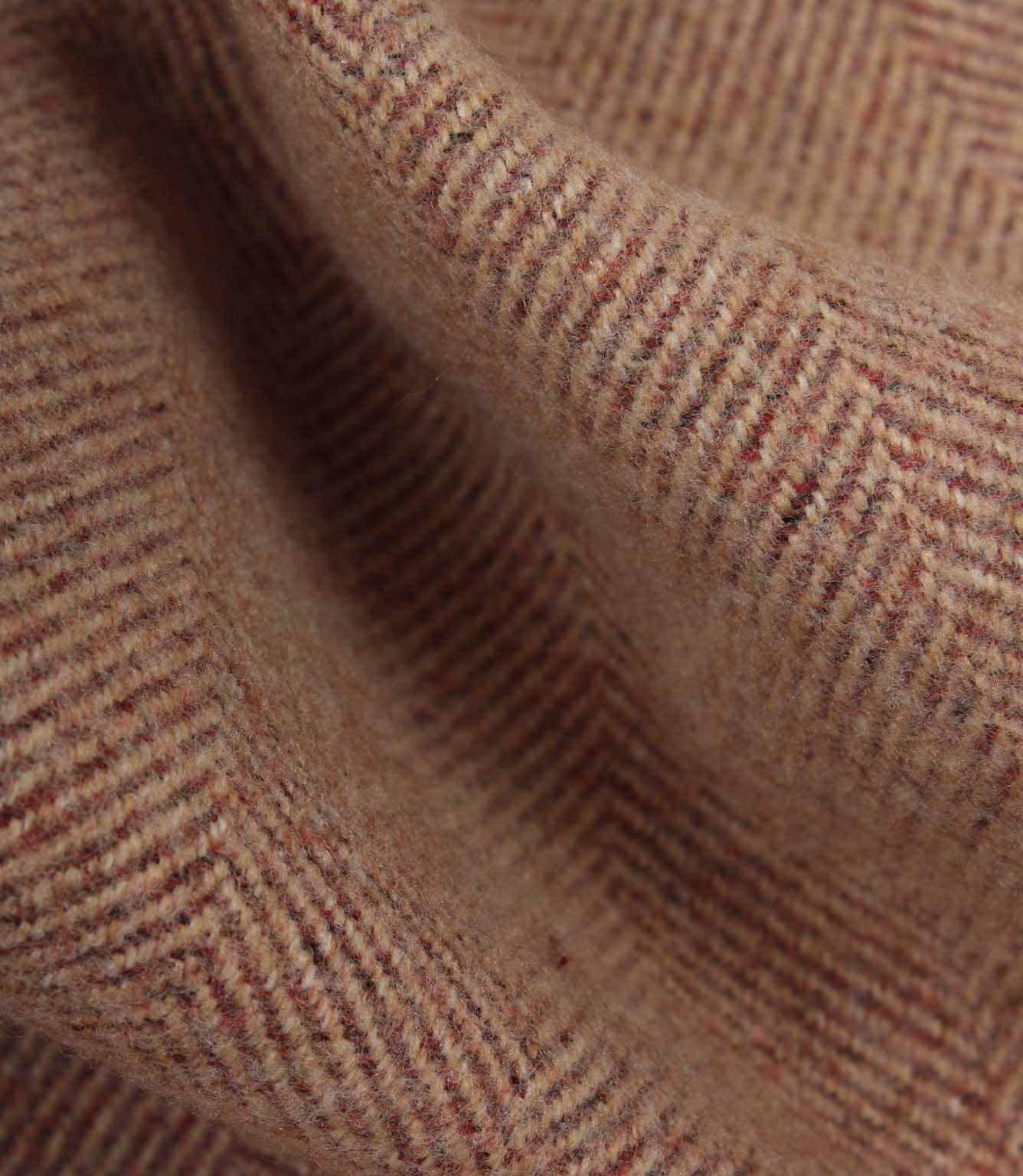Close-up of rose fabric with a herringbone pattern