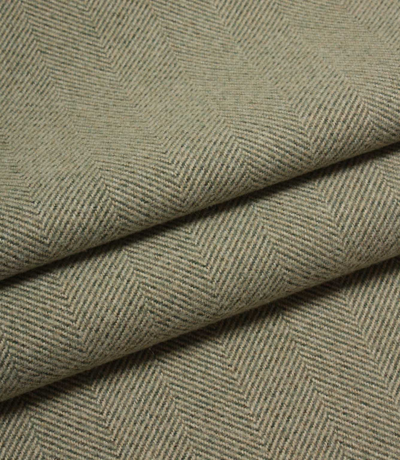 Close-up of green herringbone fabric texture