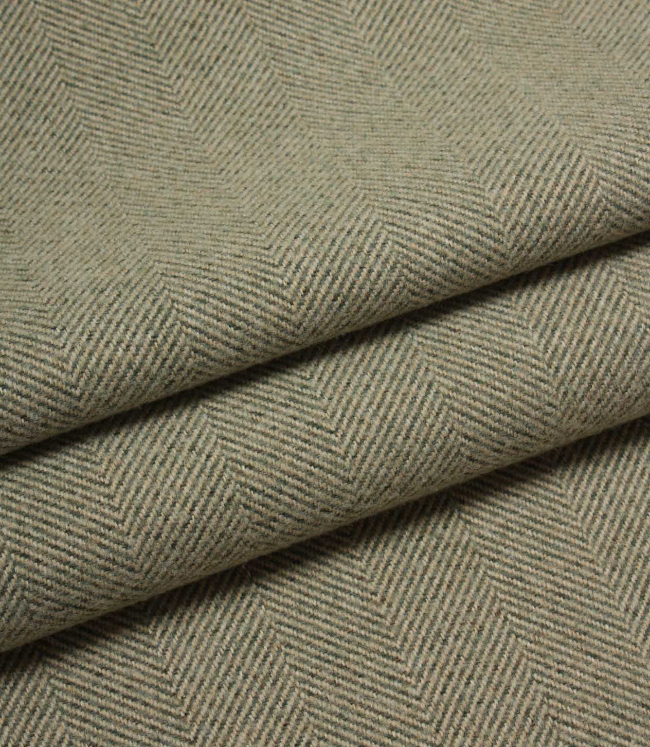 Close-up of green herringbone fabric texture