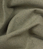 Close-up of green fabric with a herringbone pattern