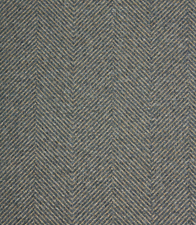 Textured fabric with a herringbone pattern in blue and beige tones.