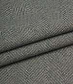 Close-up of herringbone patterned fabric in blue tones