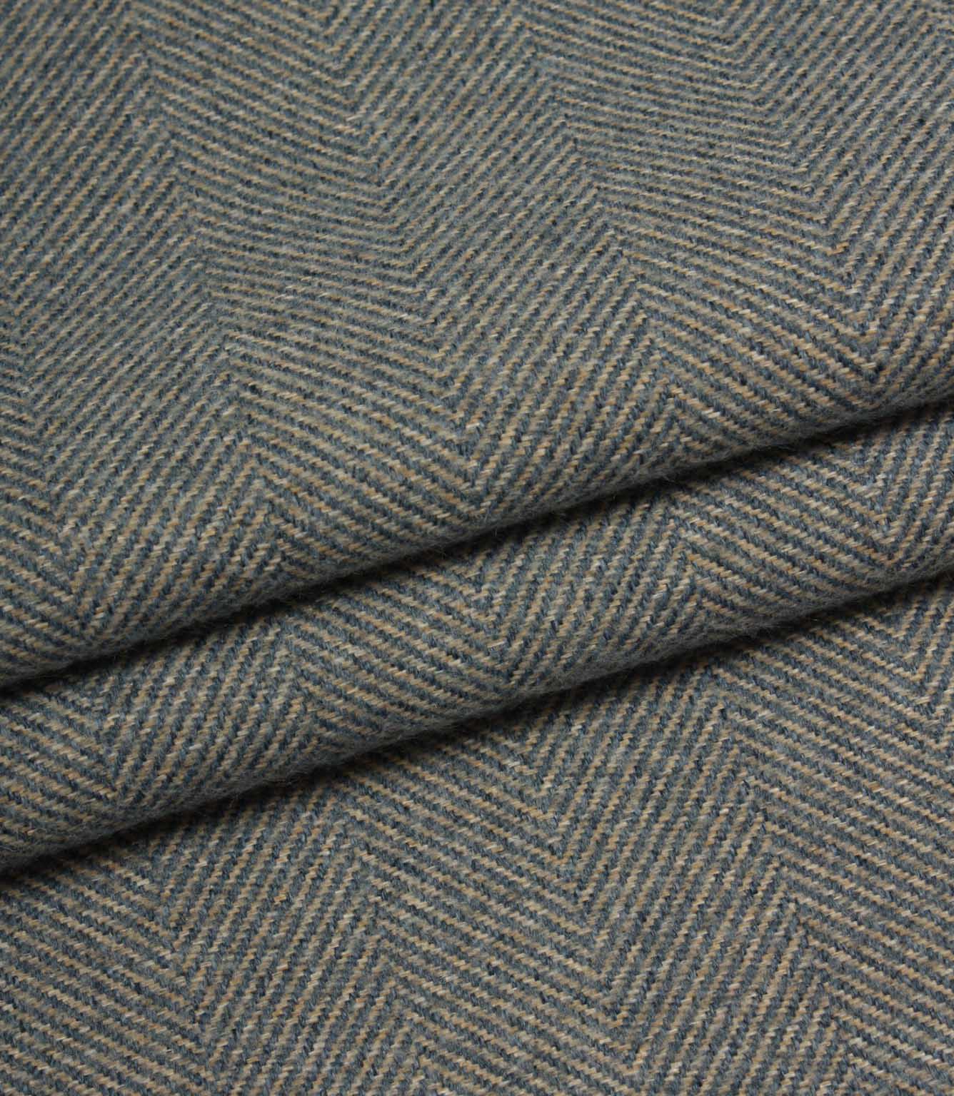 Close-up of herringbone patterned fabric in blue tones