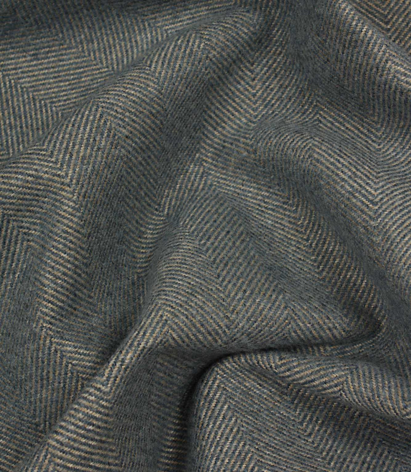 Close-up of blue herringbone fabric texture