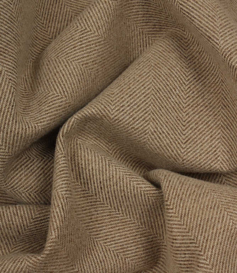Close-up of brown herringbone fabric texture