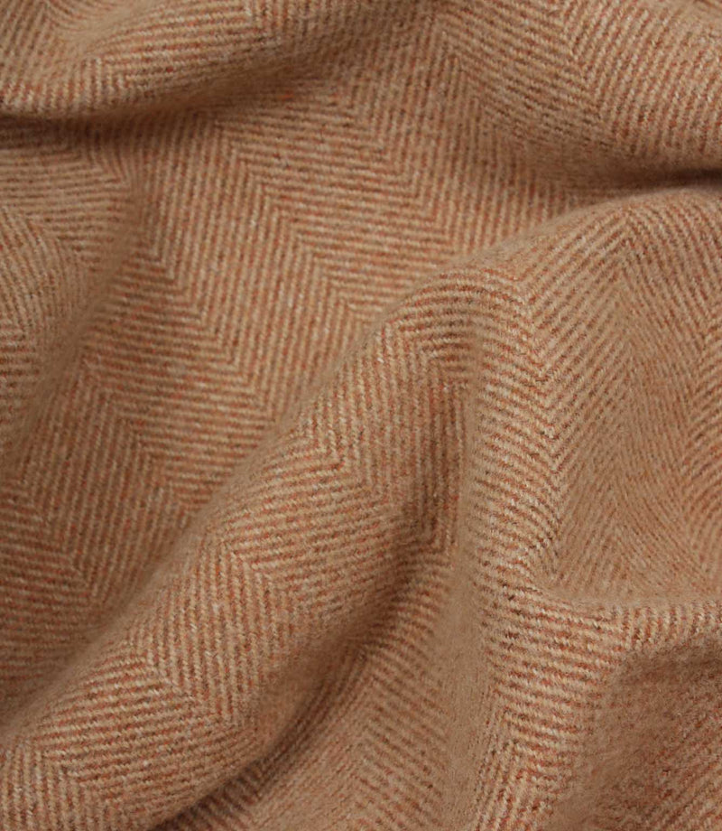 Close-up of terracotta herringbone fabric texture