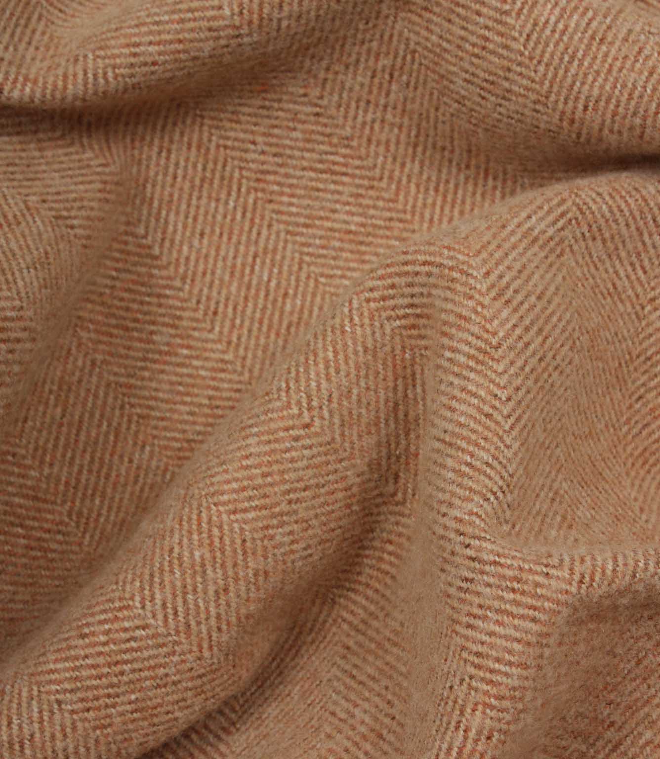 Close-up of terracotta herringbone fabric texture