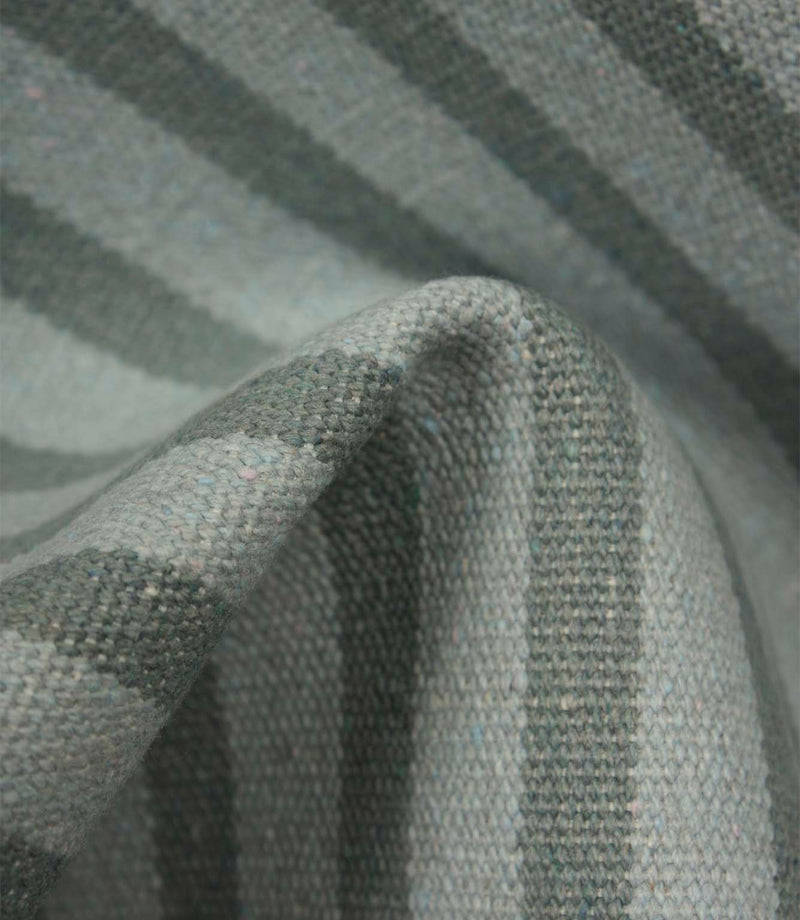 Detailed close-up of Fernley Stripe steel blue striped upholstery fabric highlighting the textured weave and classic stripe design.