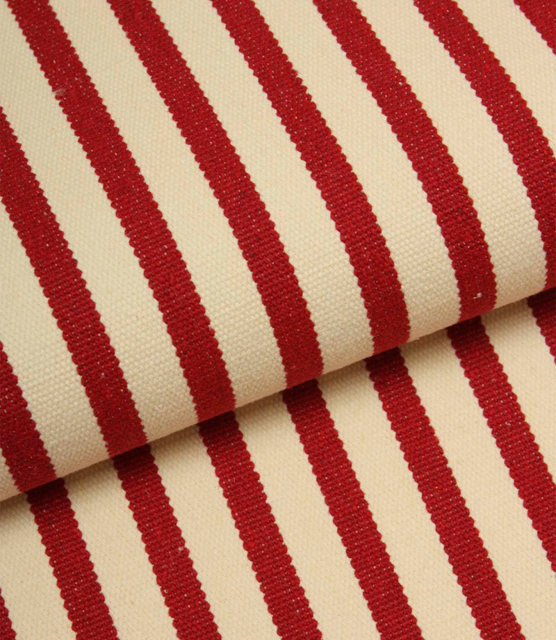 Folded Fernley Stripe upholstery fire retardant fabric featuring wine red vertical stripes and a classic woven finish.