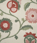 Close-up of Foxmere Chintz embroidered fabric, showing detailed raised stitching across stylised pink and red flowers, sage and deeper green leaves, curved stems and decorative flower buds on a textured natural cream base.