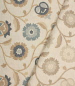 Foxmere fabric collection displaying Cornflower and Natural embroidered floral designs on a neutral linen-look base.