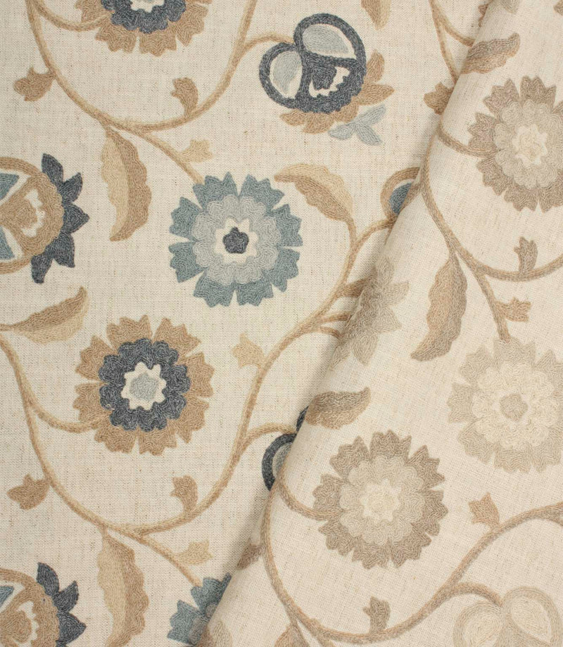 Foxmere fabric collection displaying Cornflower and Natural embroidered floral designs on a neutral linen-look base.
