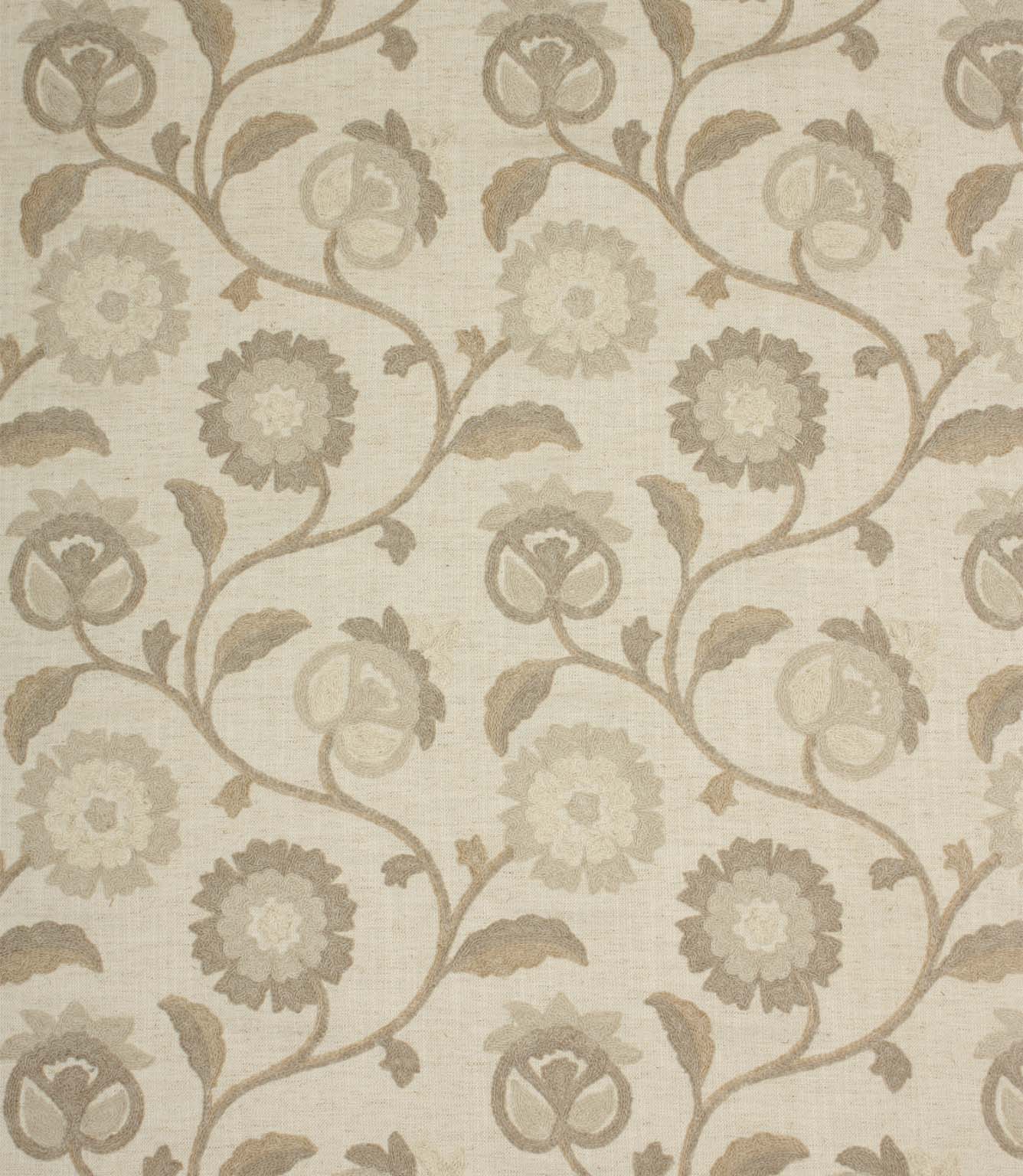 Embroidered floral fabric with trailing vines and stylised flower motifs in soft natural, beige and cream tones on a linen-look background.