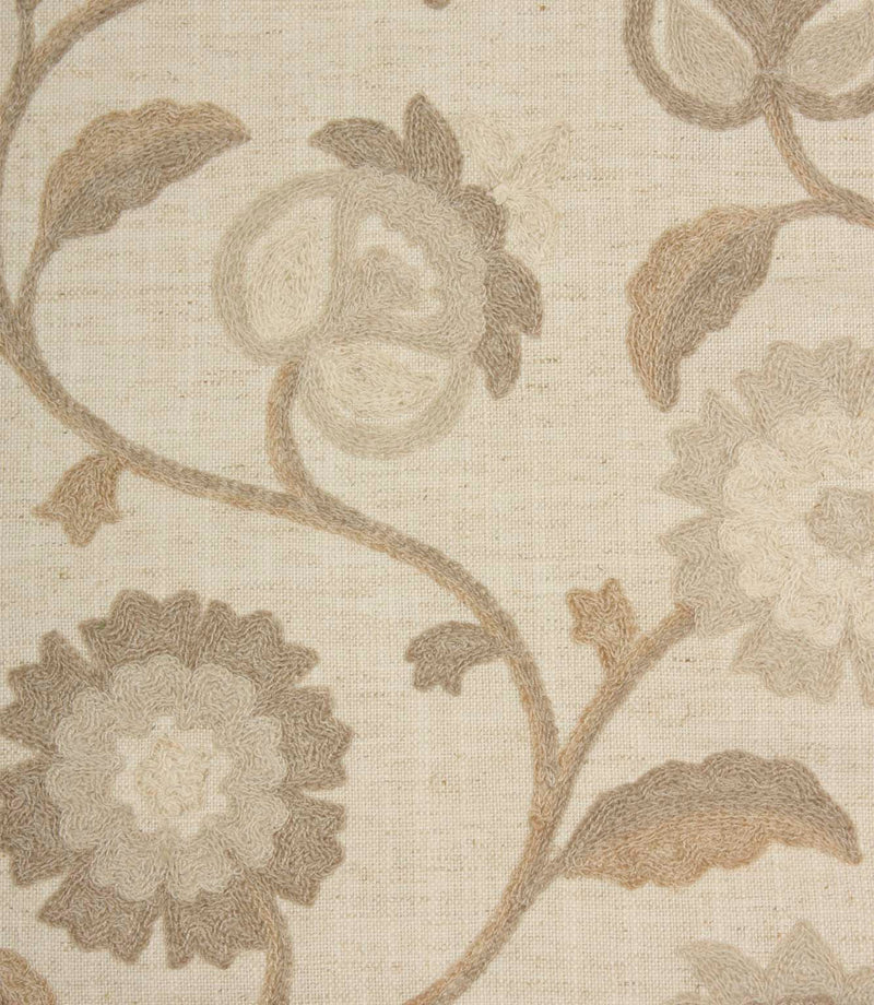 Close-up of Foxmere Natural fabric highlighting textured embroidery and tonal floral detailing in warm neutral shades.