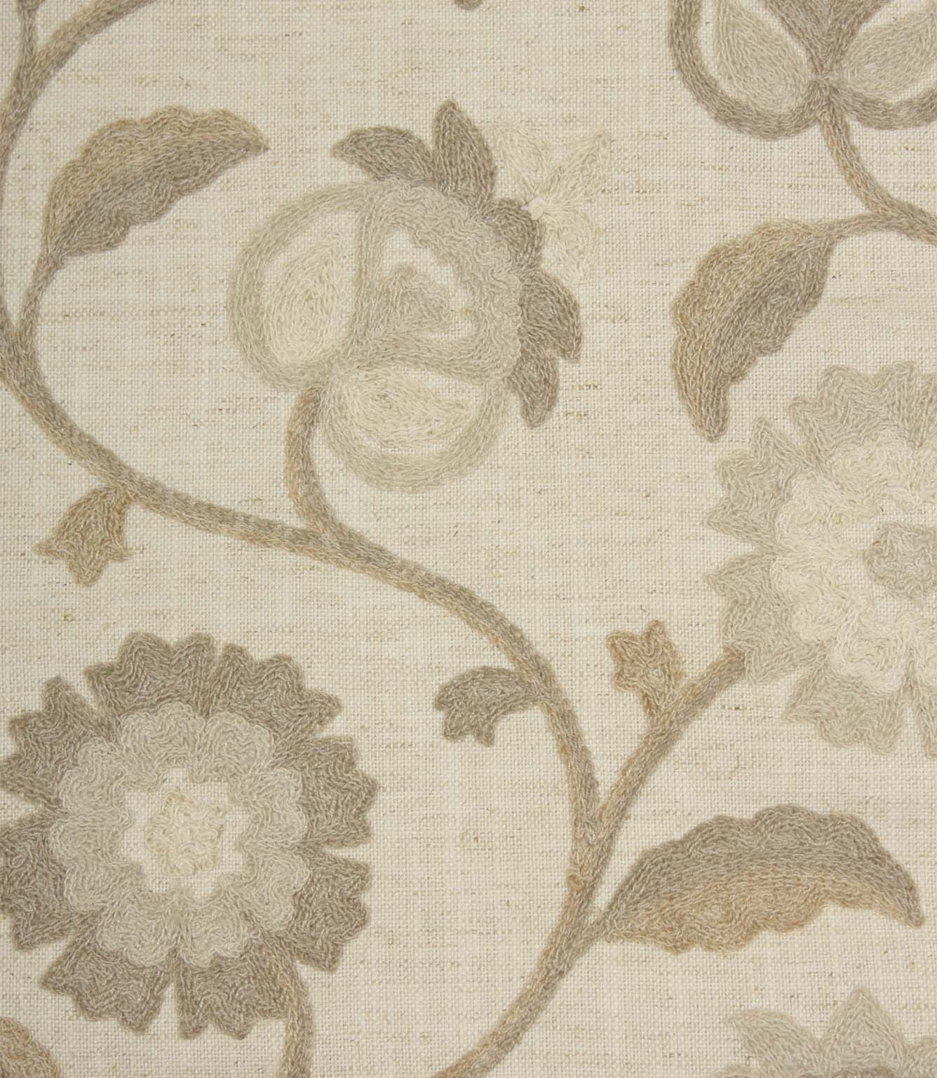 Close-up of Foxmere Natural fabric highlighting textured embroidery and tonal floral detailing in warm neutral shades.
